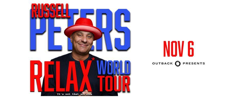 Russell Peters in a red hat promoting his RELAX world tour