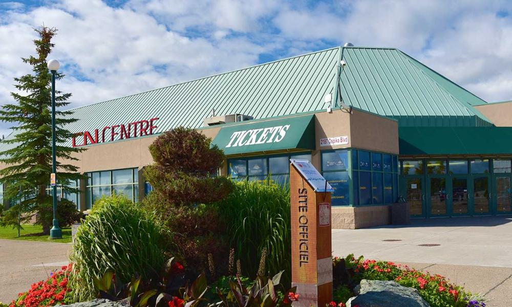 The outside of the CN Centre with blooming flowers in spring.