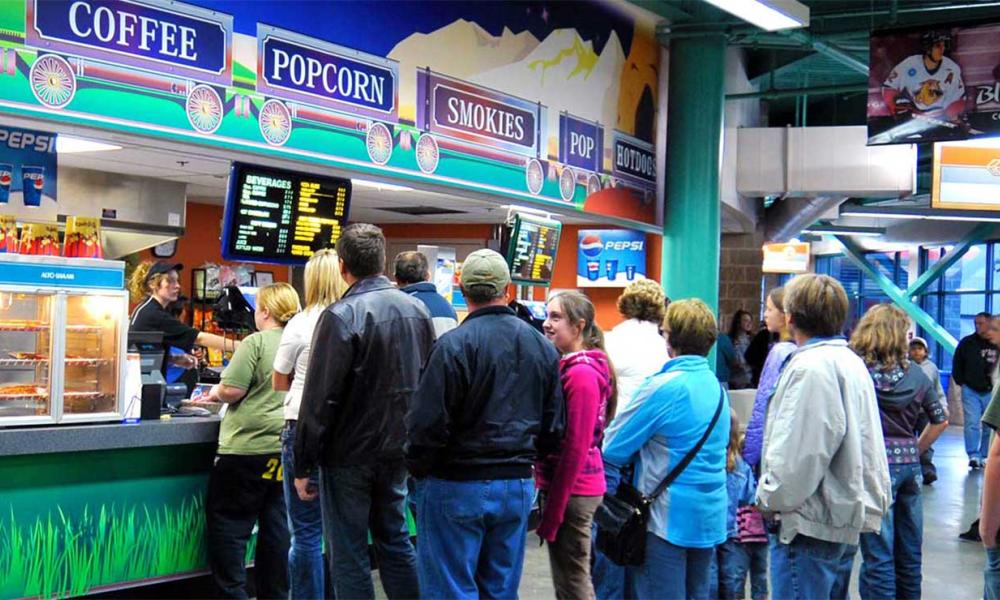 Customers waiting in line for food at one of the CN Centre's concession stands.